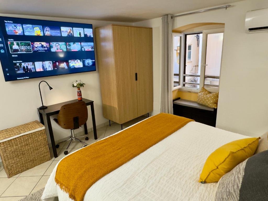 Master bedroom TV and wardrobe